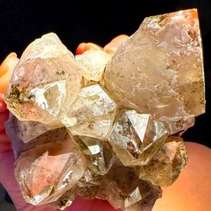 Large quartz, amethyst, and epidote combo with phantoms terminations red quartz